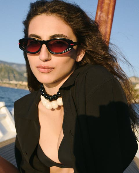 Woman wearing Christian Louboutin sunglasses.