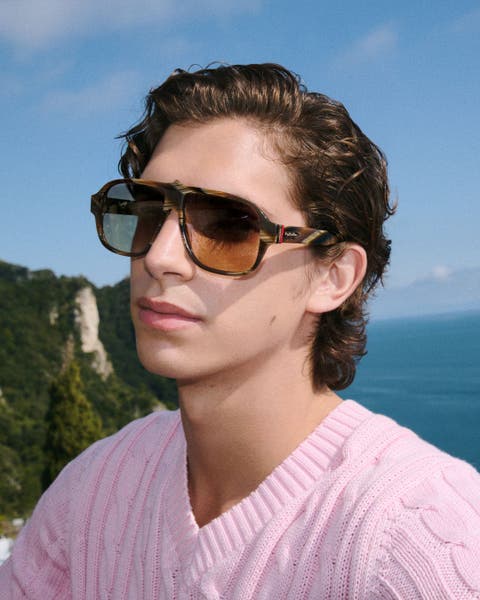 Man wearing Christian Louboutin sunglasses.