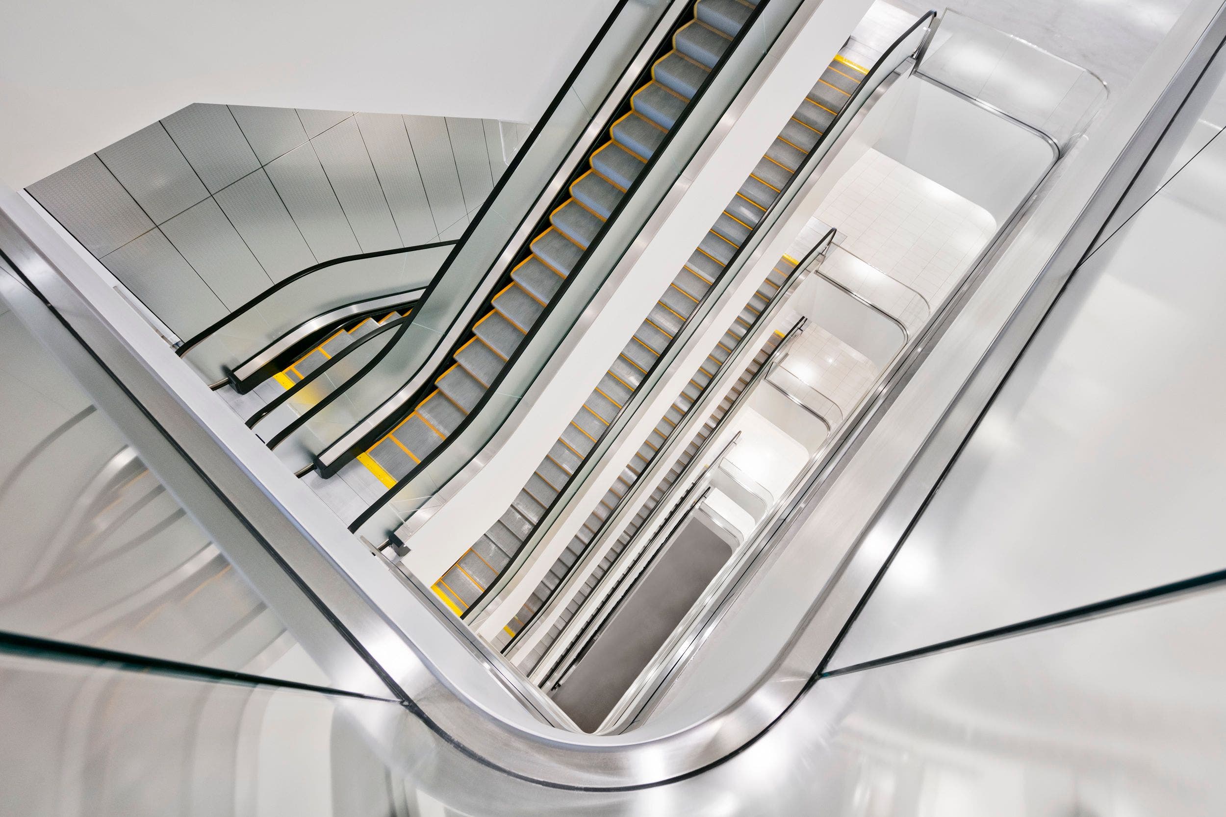 A view of multiple escalators in a Nordstrom store. 