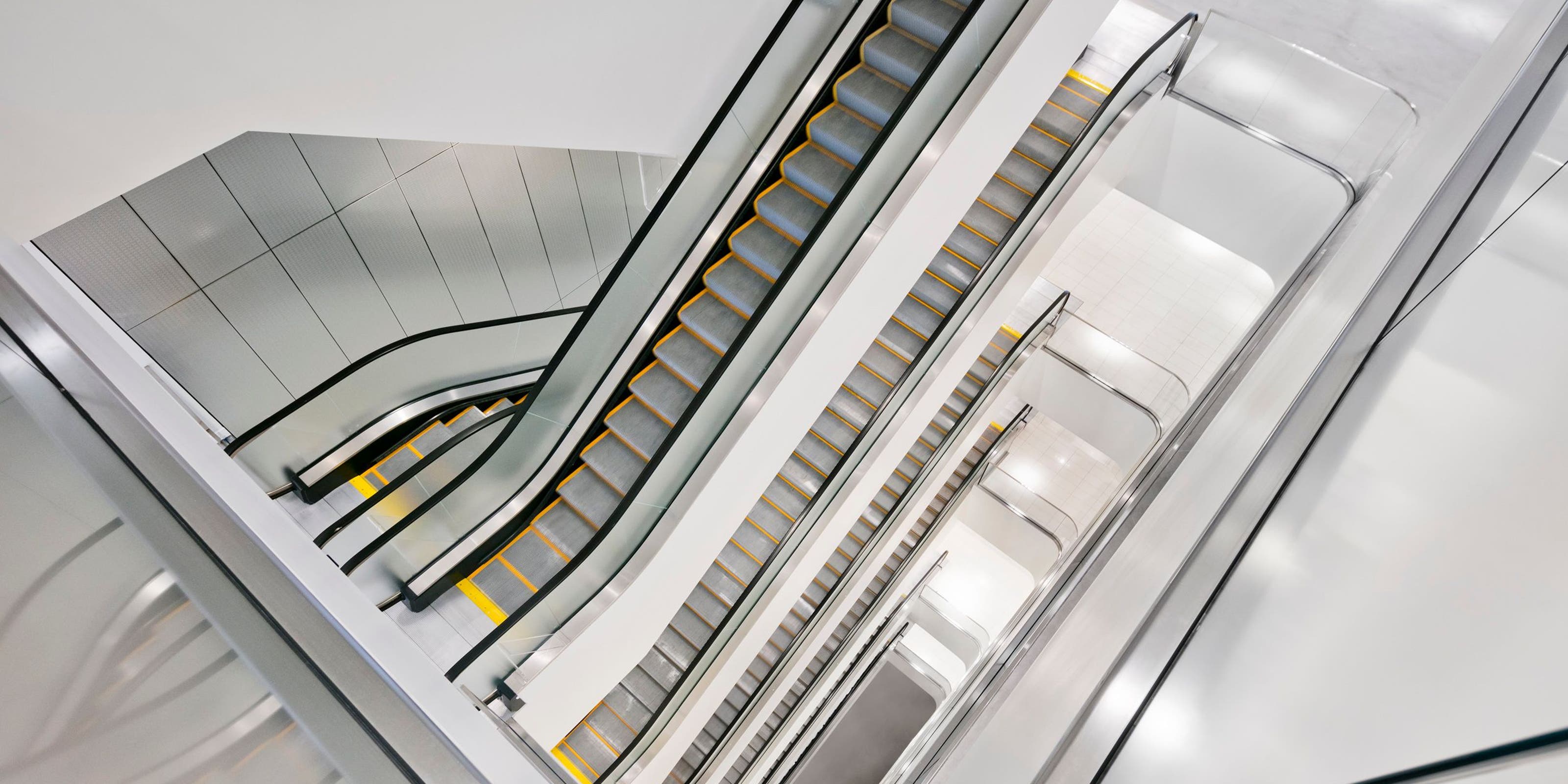 A view of multiple escalators in a Nordstrom store.