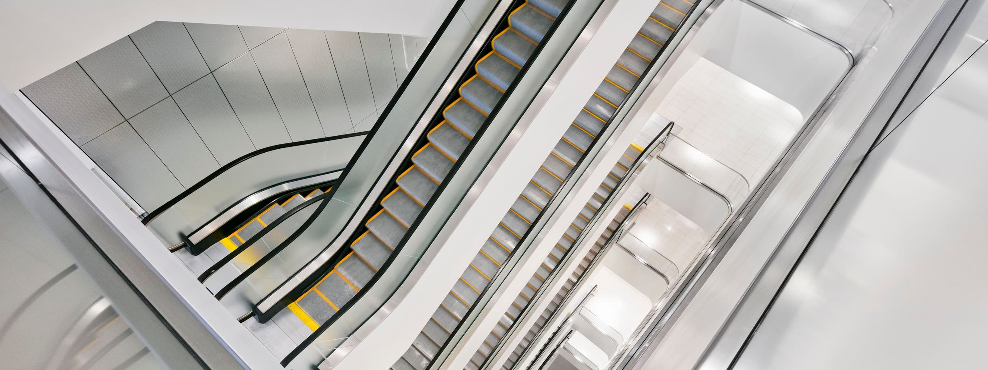 A view of multiple escalators in a Nordstrom store.