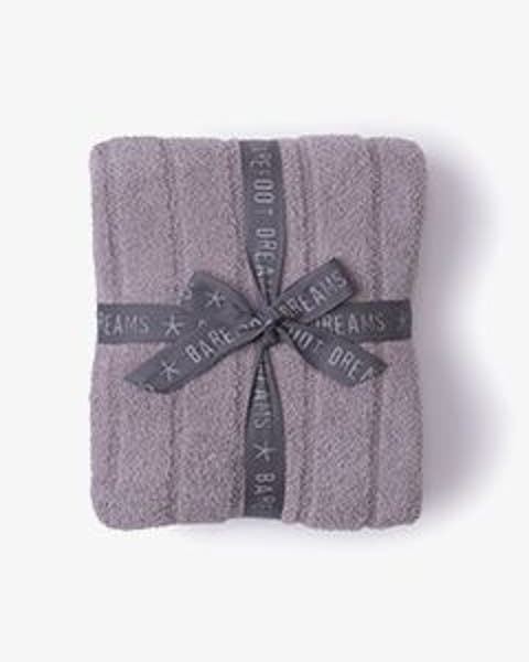 A grey Barefoot Dreams blanket.
