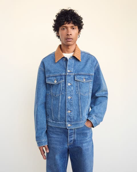 A man wearing a denim jacket.