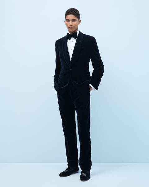 Man wearing a tuxedo and dress shoes.