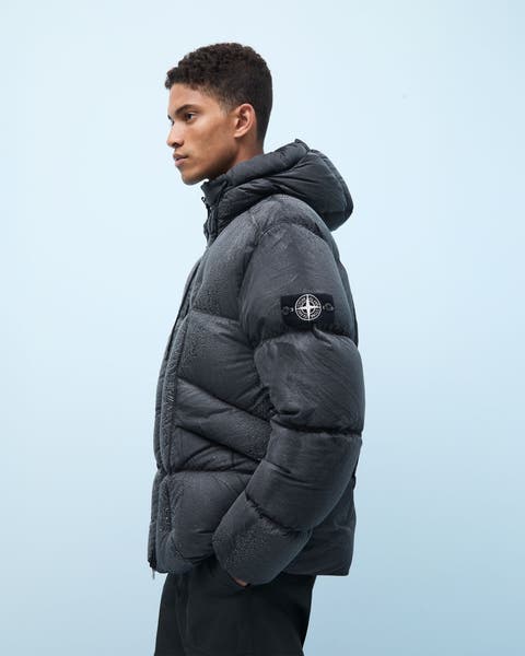 Man wearing a puffer jacket and pants.