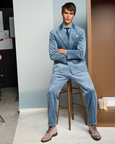 A man in blue velvet suit.