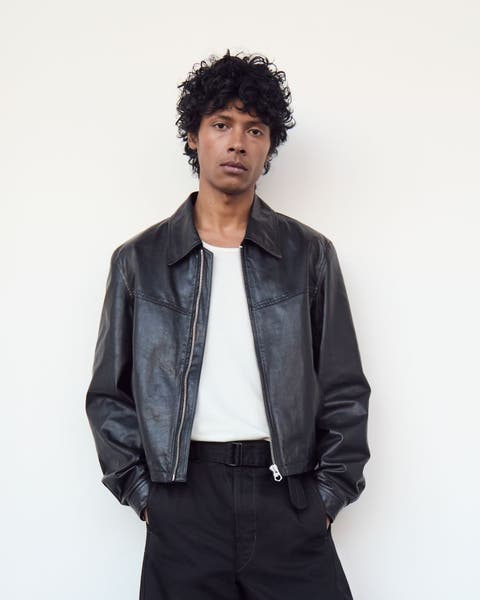 A man wearing a leather jacket.