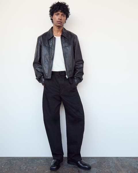 Man wearing Lemaire jacket, T-shirt, pants and shoes.