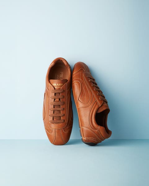 Brown leather sneakers from Prada.