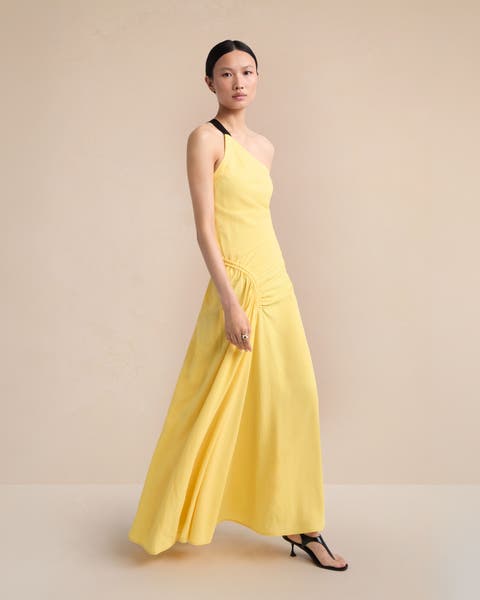 Woman wearing a yellow Proenza Schouler dress.