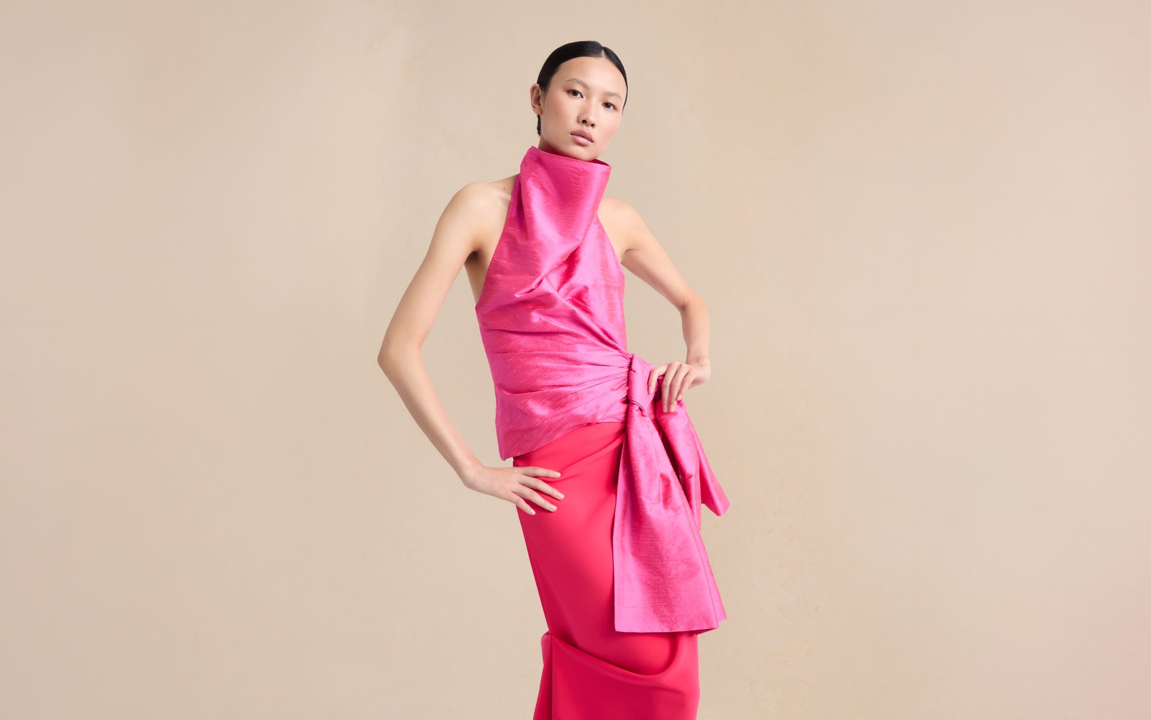 Woman wearing Christopher John Rogers top and skirt.