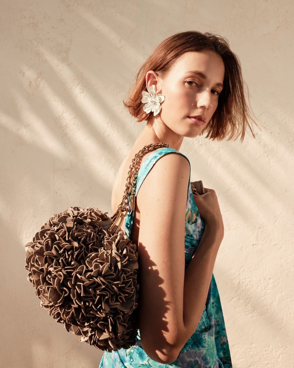 Woman carrying a Chloé handbag.