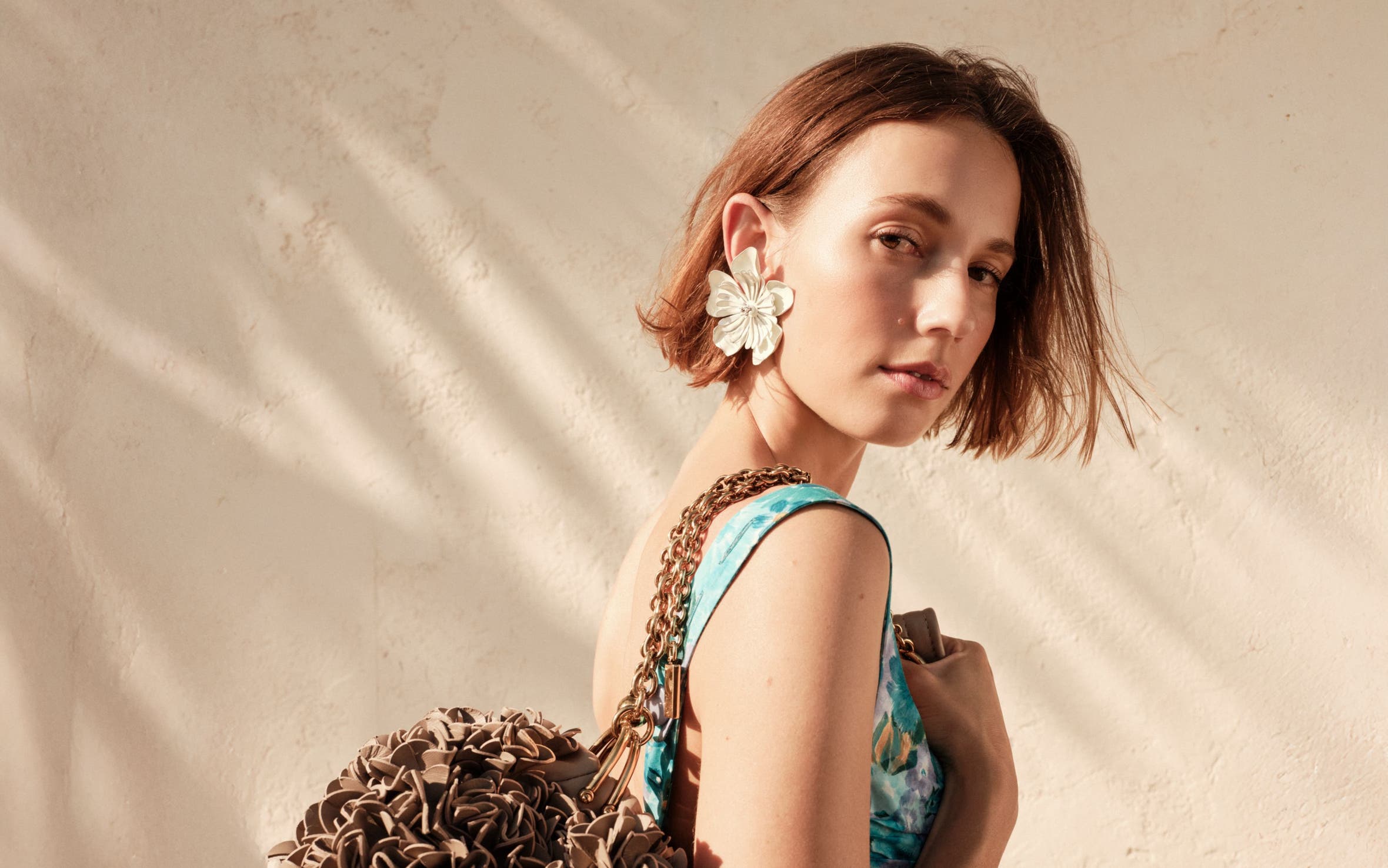 Woman carrying a Chloé handbag.