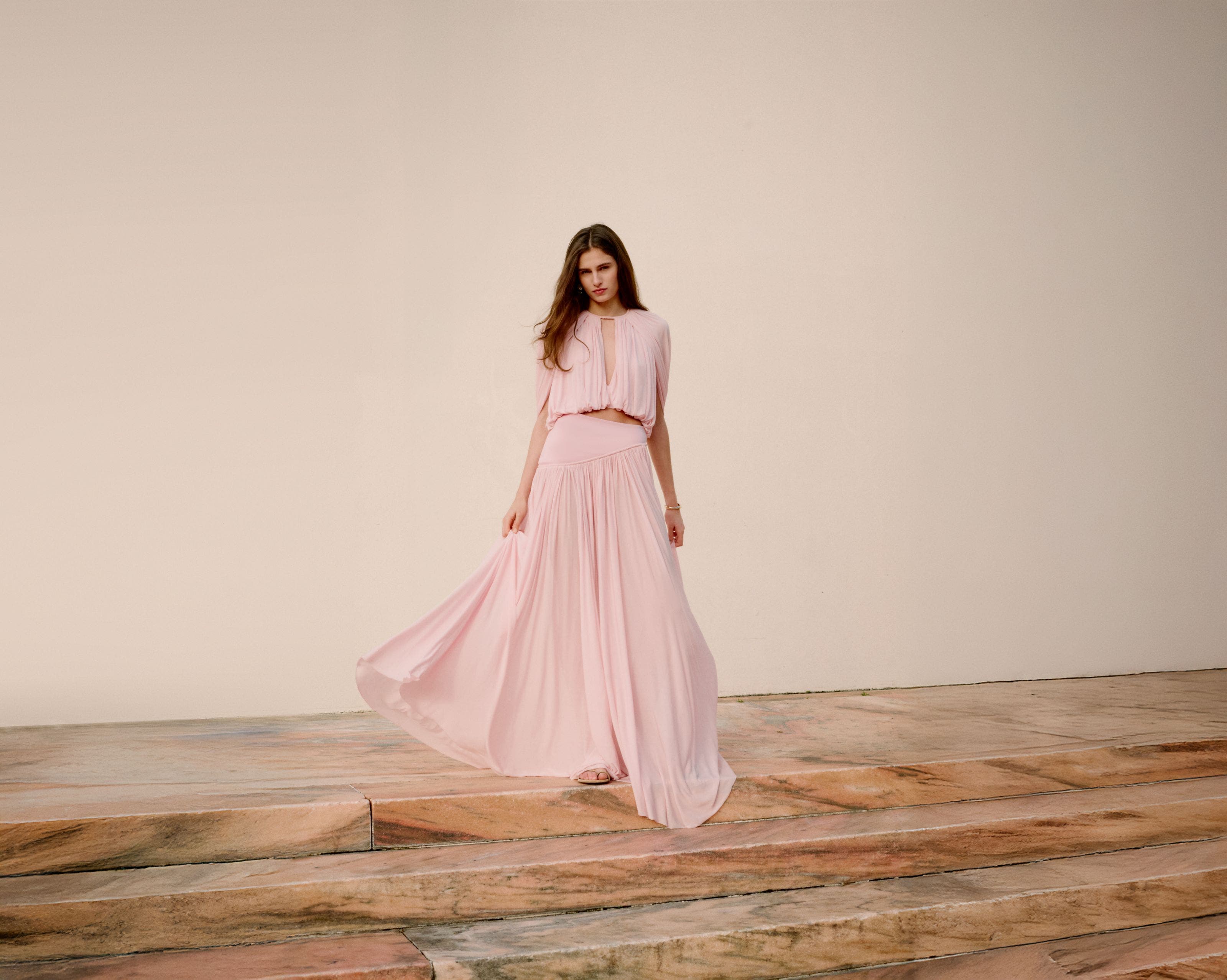 Woman wearing Zimmermann blouse and skirt.