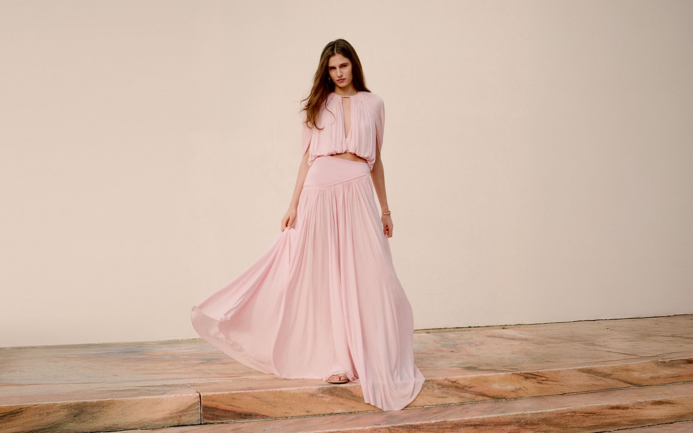 Woman wearing Zimmermann blouse and skirt.