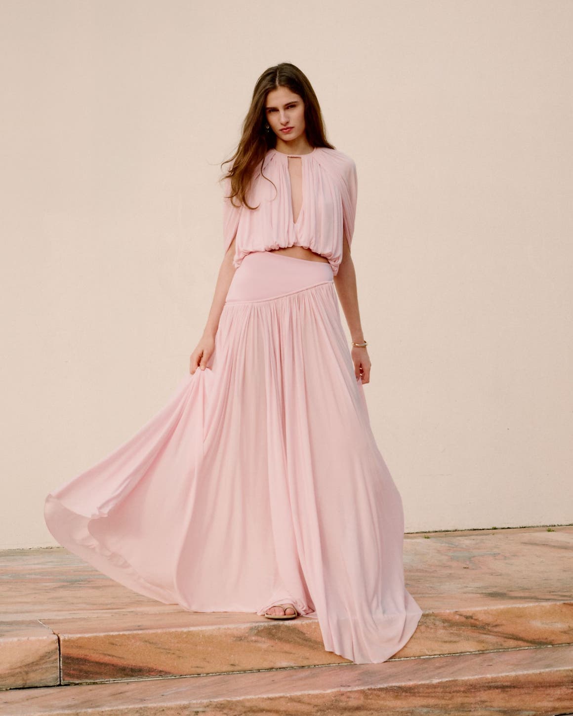 Woman wearing Zimmermann blouse and skirt.