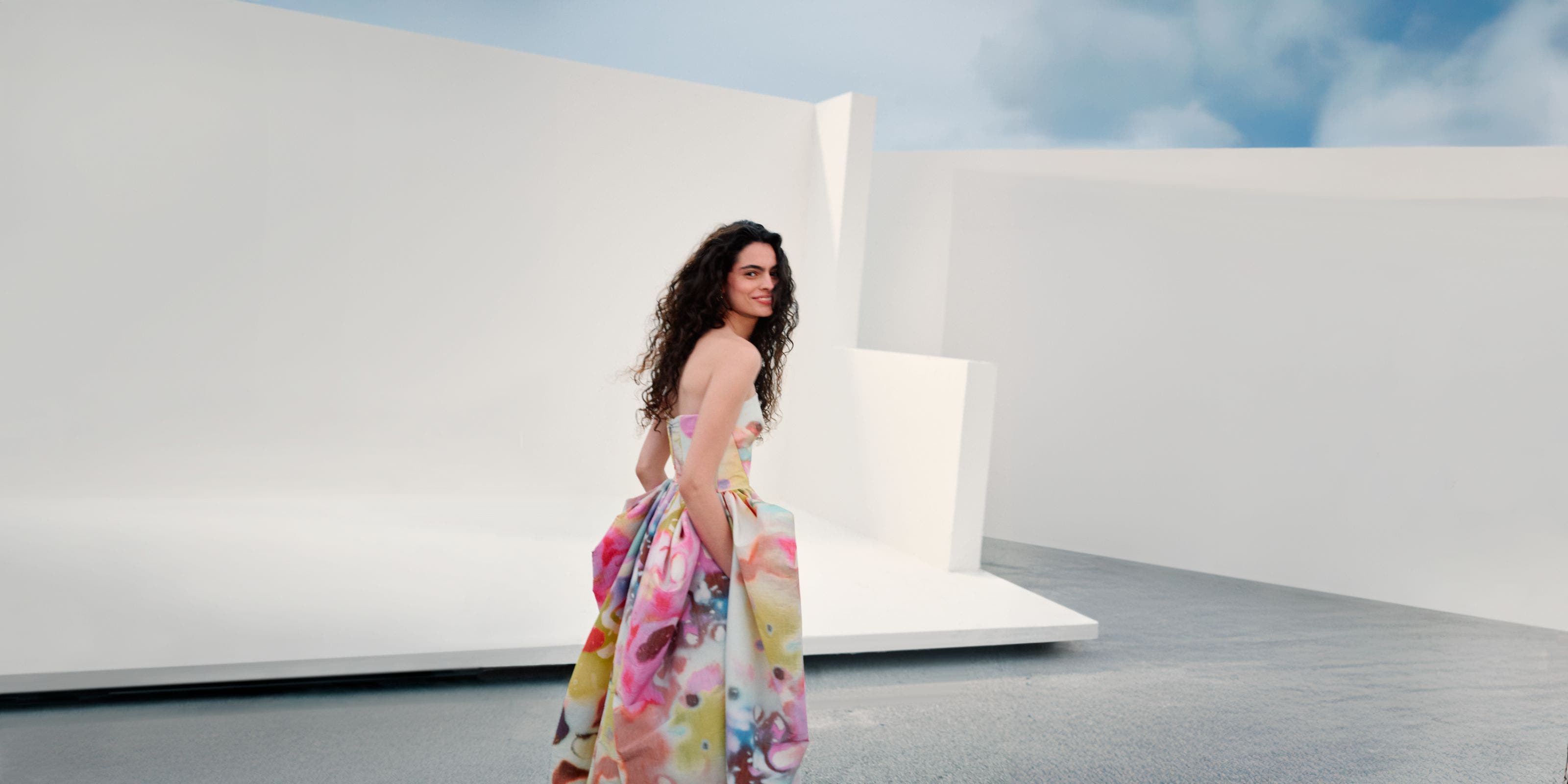 Woman wearing Christopher John Rogers gown.