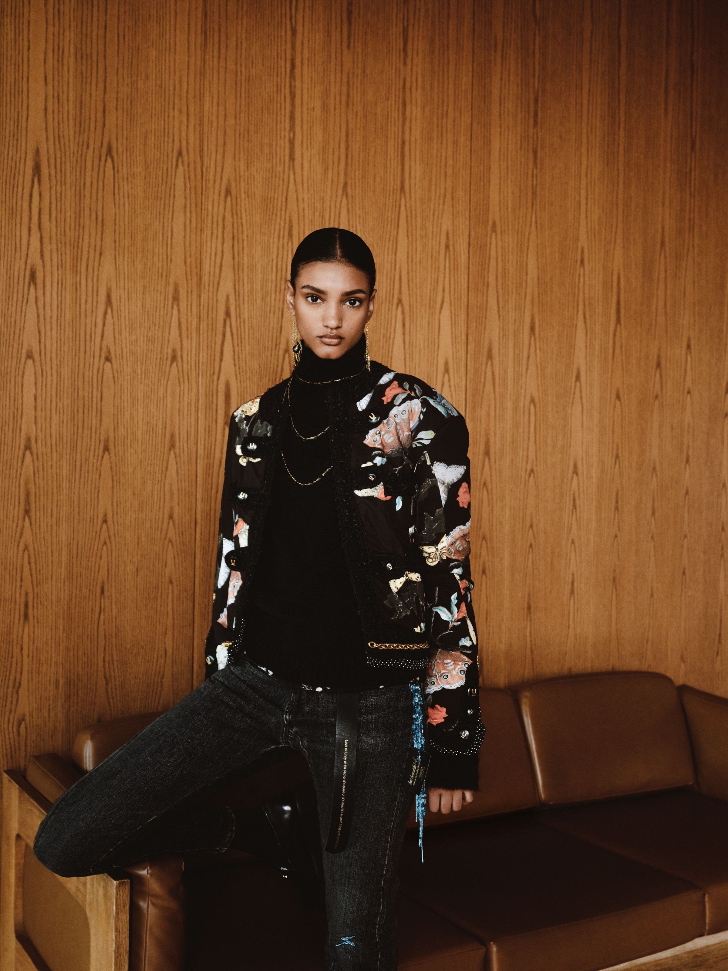 A woman wearing a printed jacket.