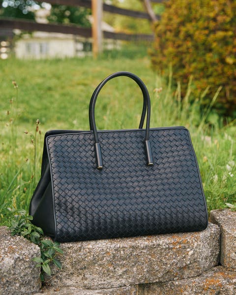 Women's black textured handbag.