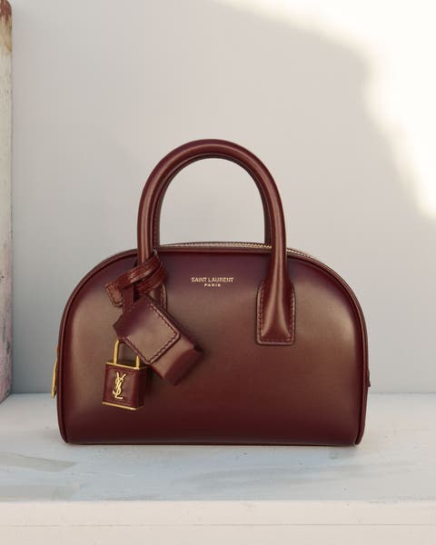 Structured top-handle handbag in burgundy leather with gold hardware