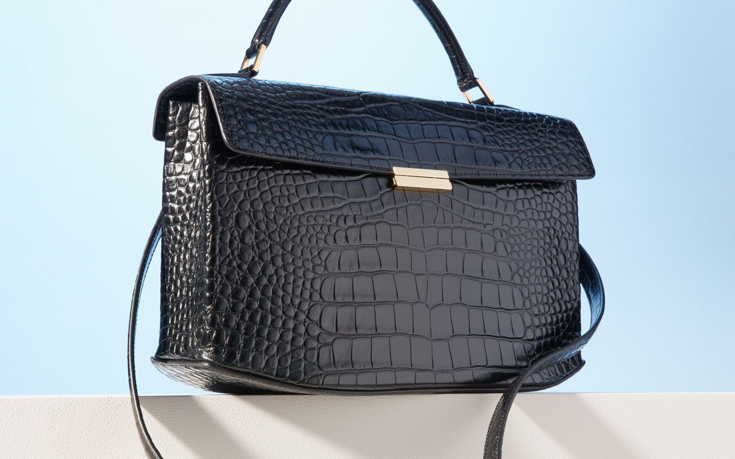 Black Toteme croc embossed top handle bag.