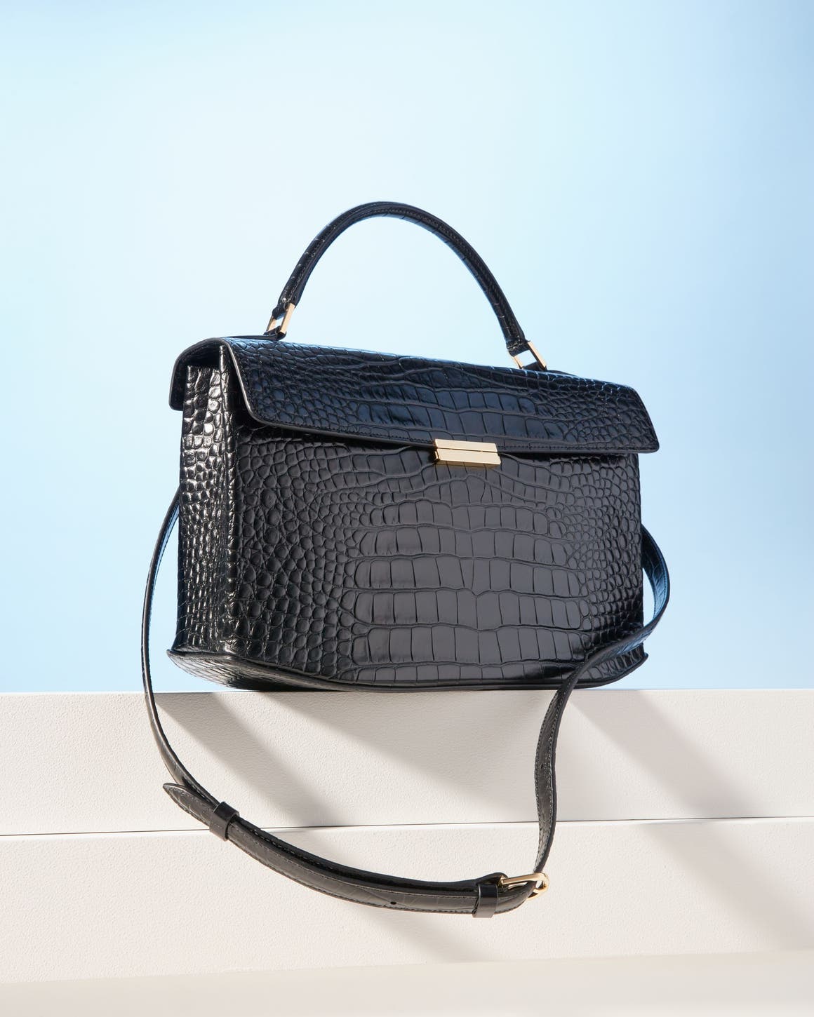 Black Toteme croc embossed top handle bag.