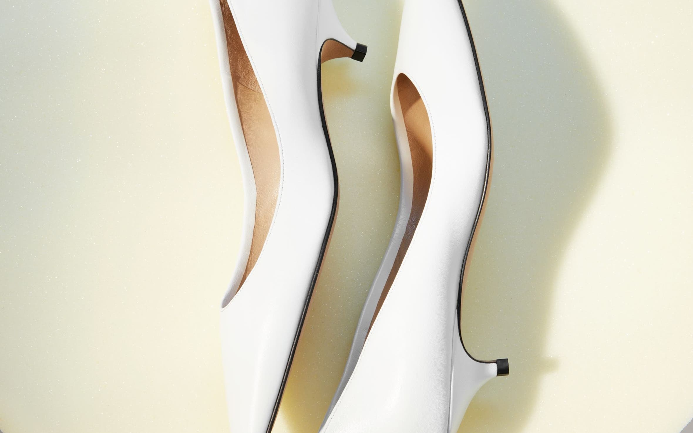 The Row kitten heels in white.