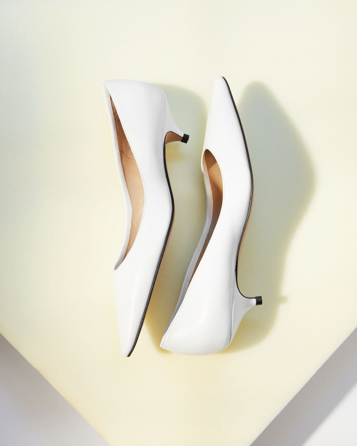 The Row kitten heels in white.