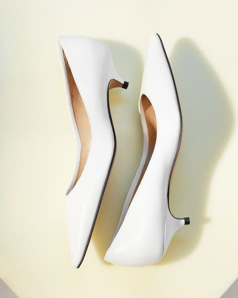 The Row kitten heels in white.