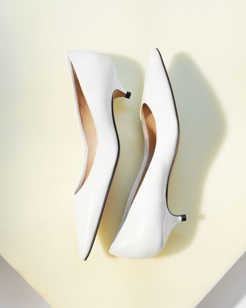The Row kitten heels in white.