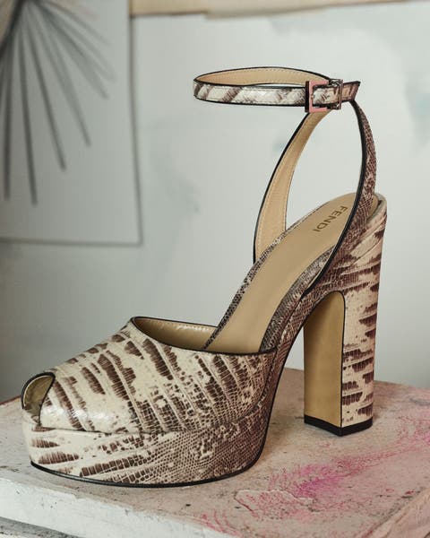 Strappy metallic gold high-heel sandal.