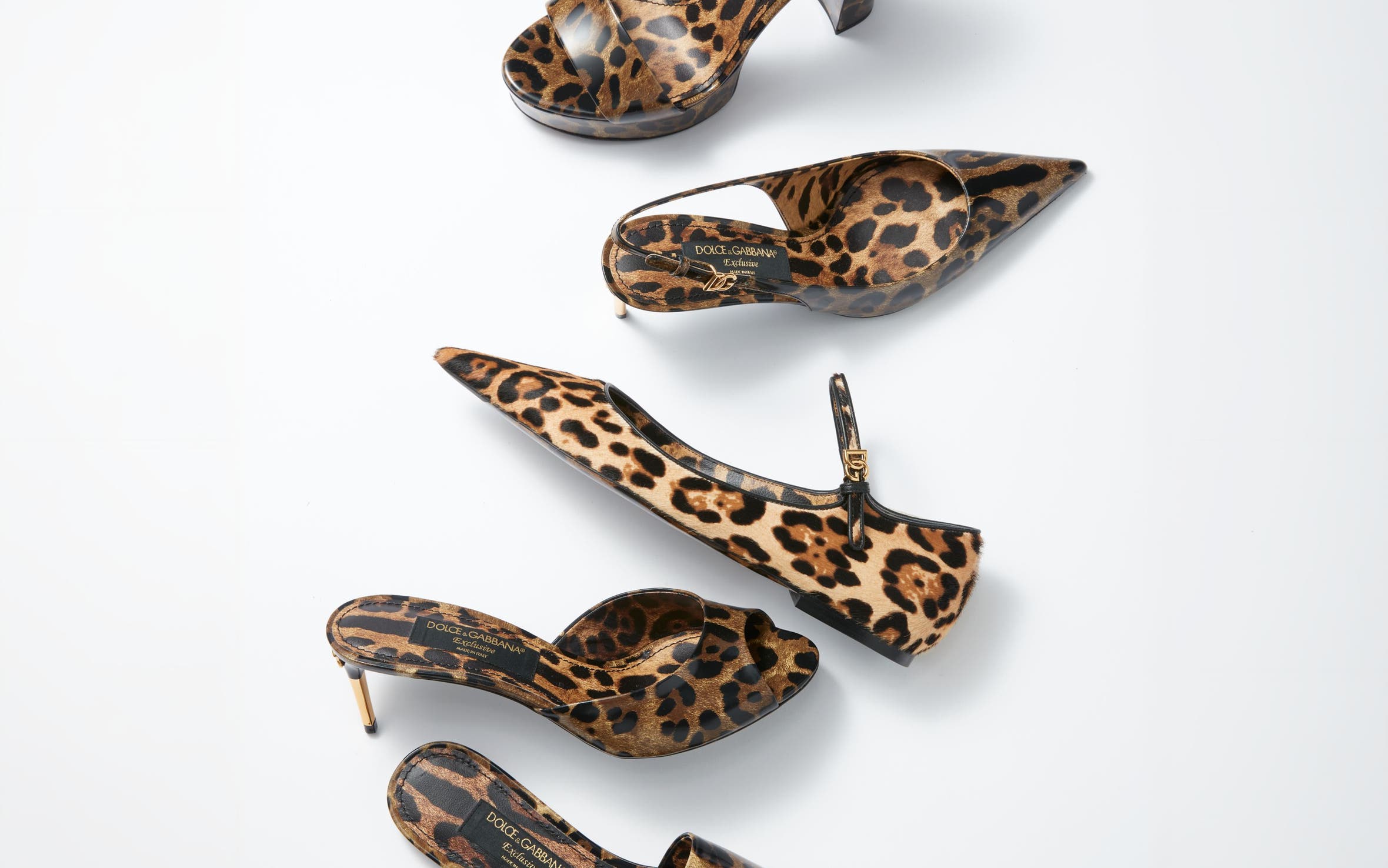 Assorted leopard-print heels, mules and flats with gold hardware