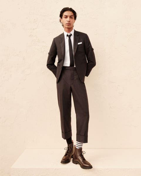 Man wearing a Thom Browne jacket and pants.