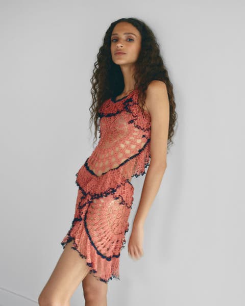 Woman wearing a crochet matching set.