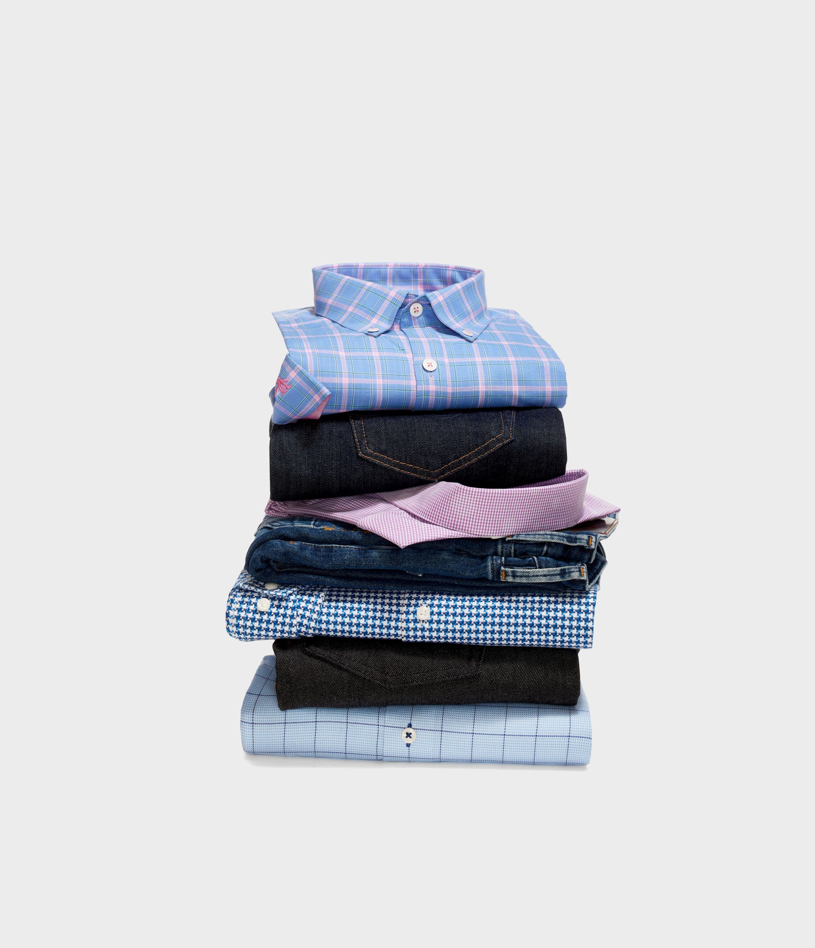 A stack of men’s dress shirts. 