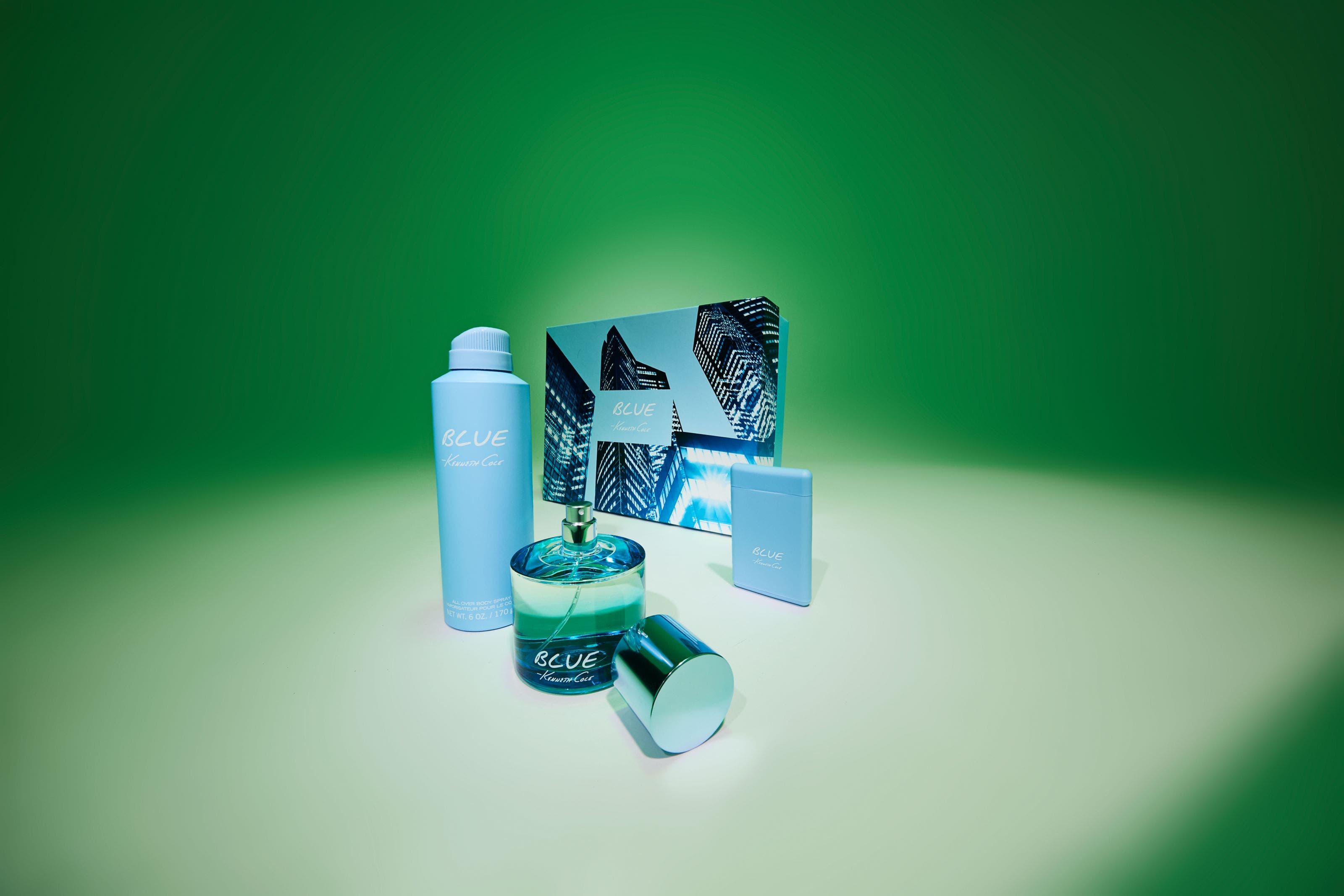 Kenneth Cole Blue fragrance gift set including eau de toilette, body spray, and mini bottle with gift box.