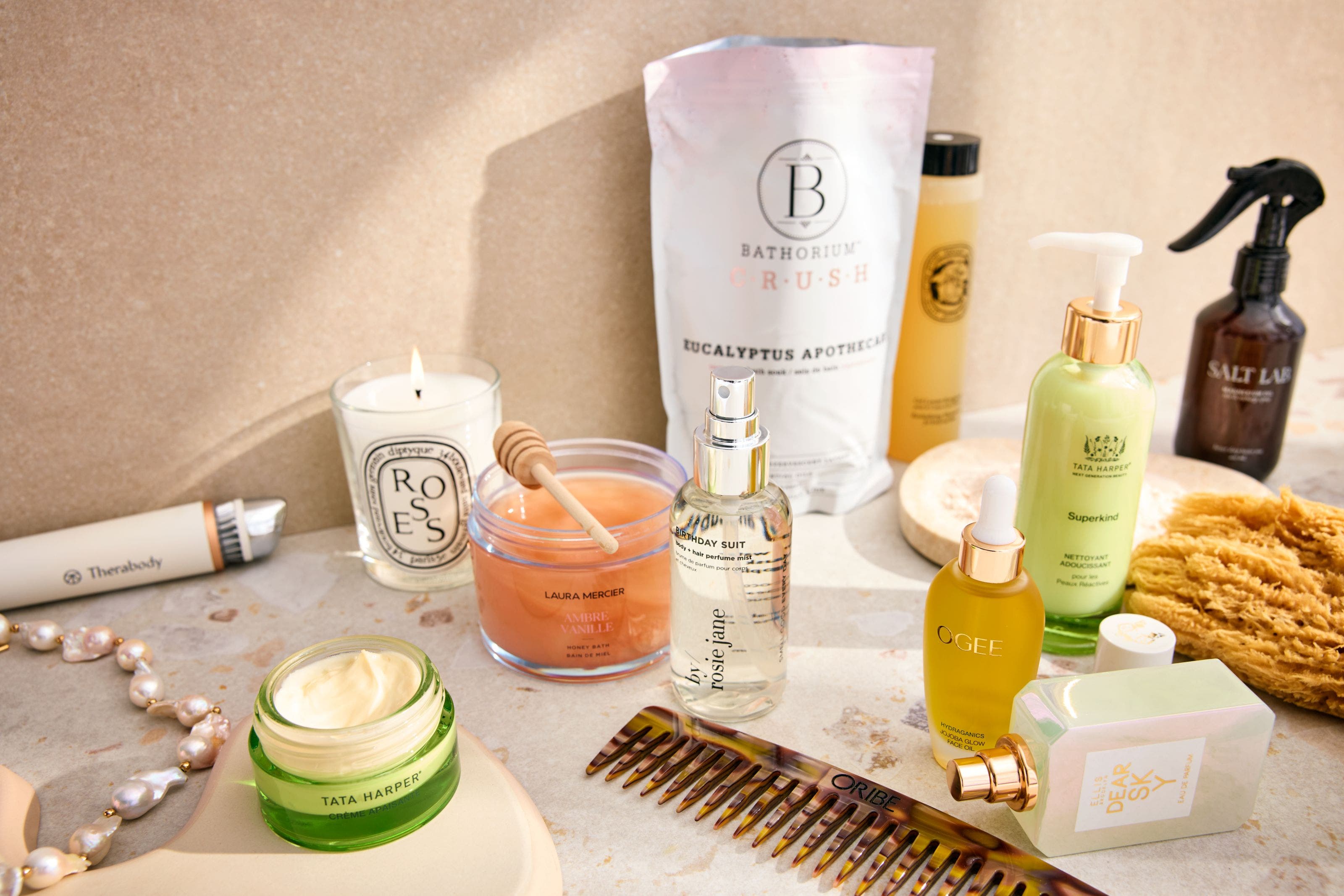 Beauty and fragrance product on a marble table.