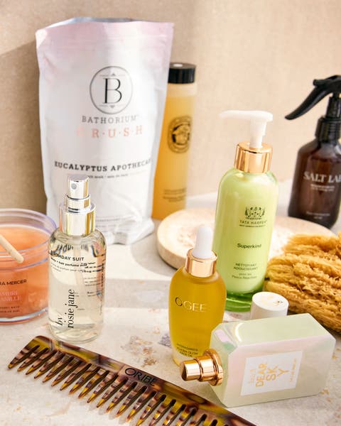 Beauty and fragrance product on a marble table.