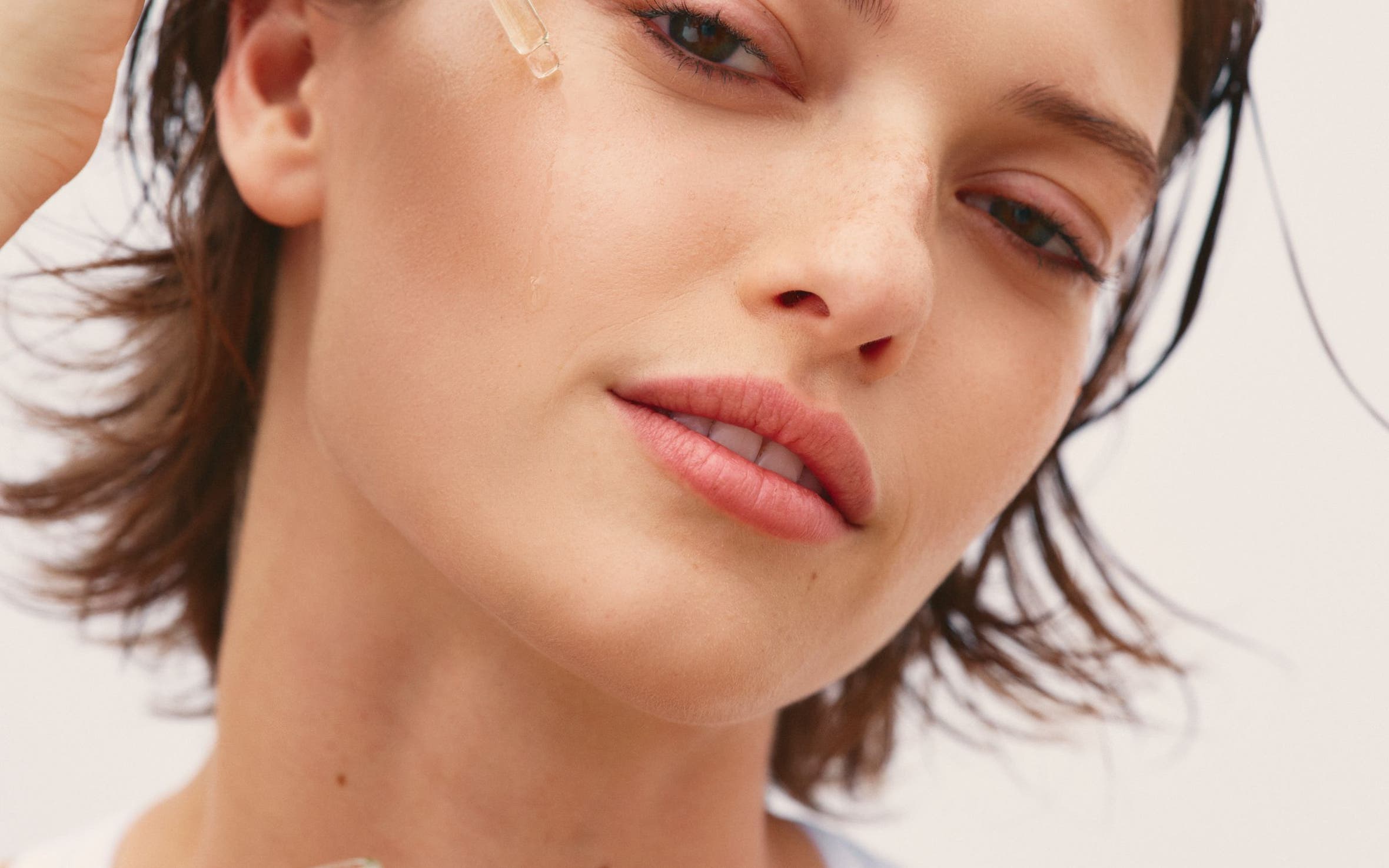 Women applying skin care.