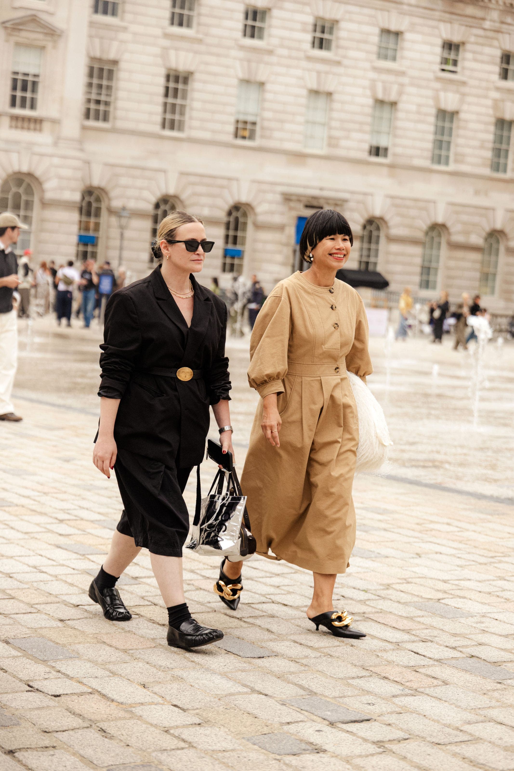 Two women outside the shows at London Fashion Week.