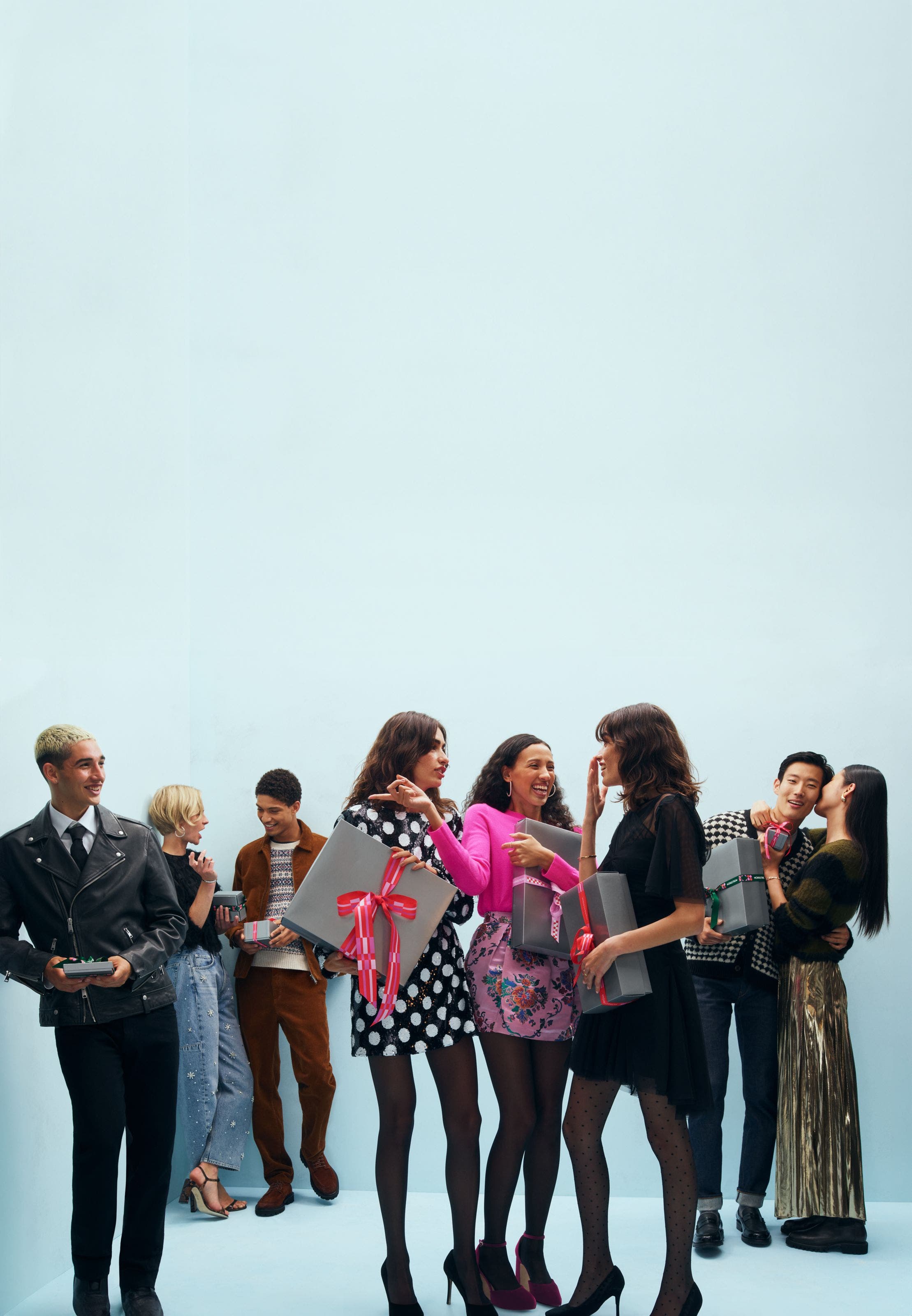 A group of people holding gift boxes.