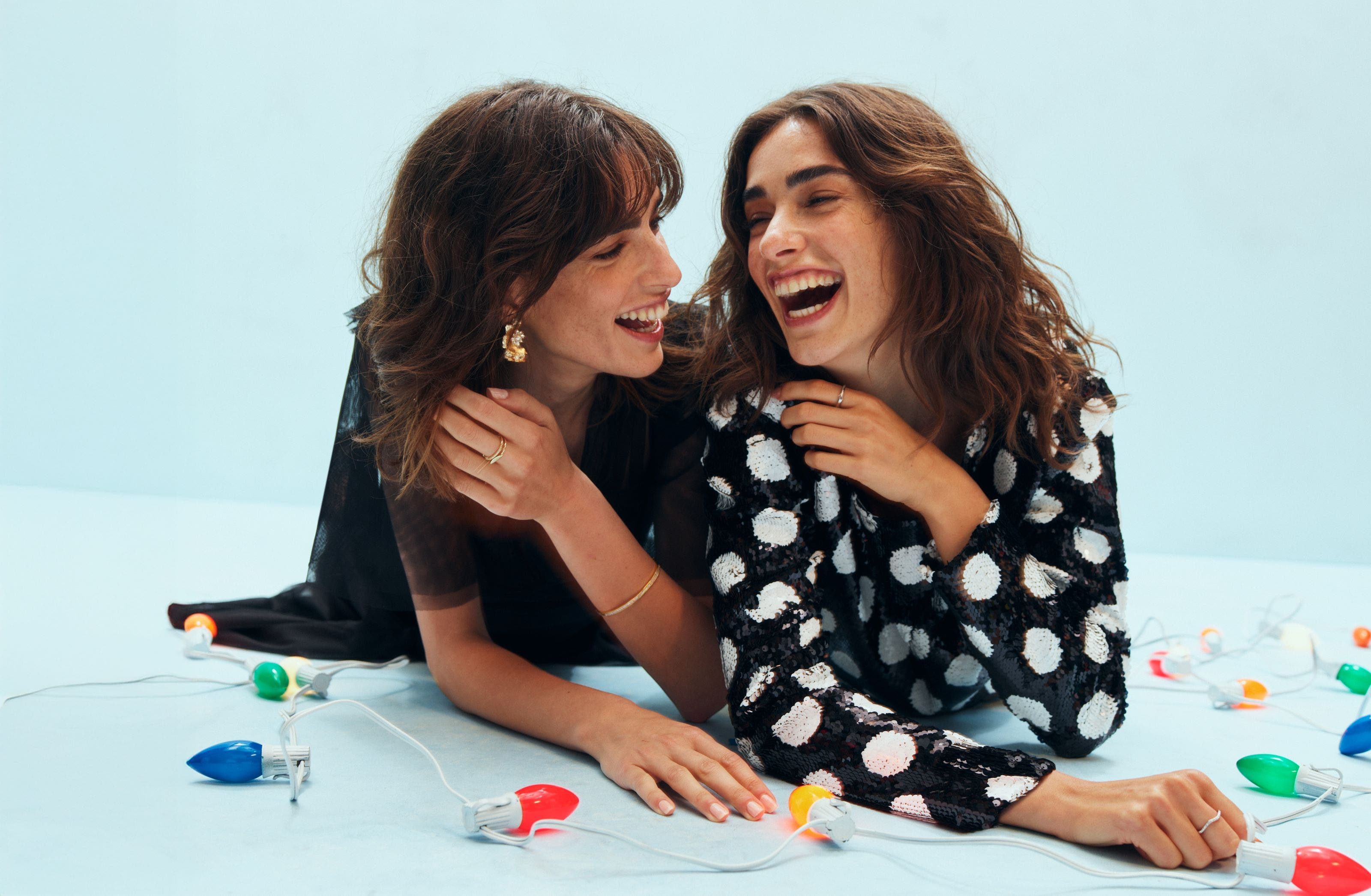 Two women laughing.