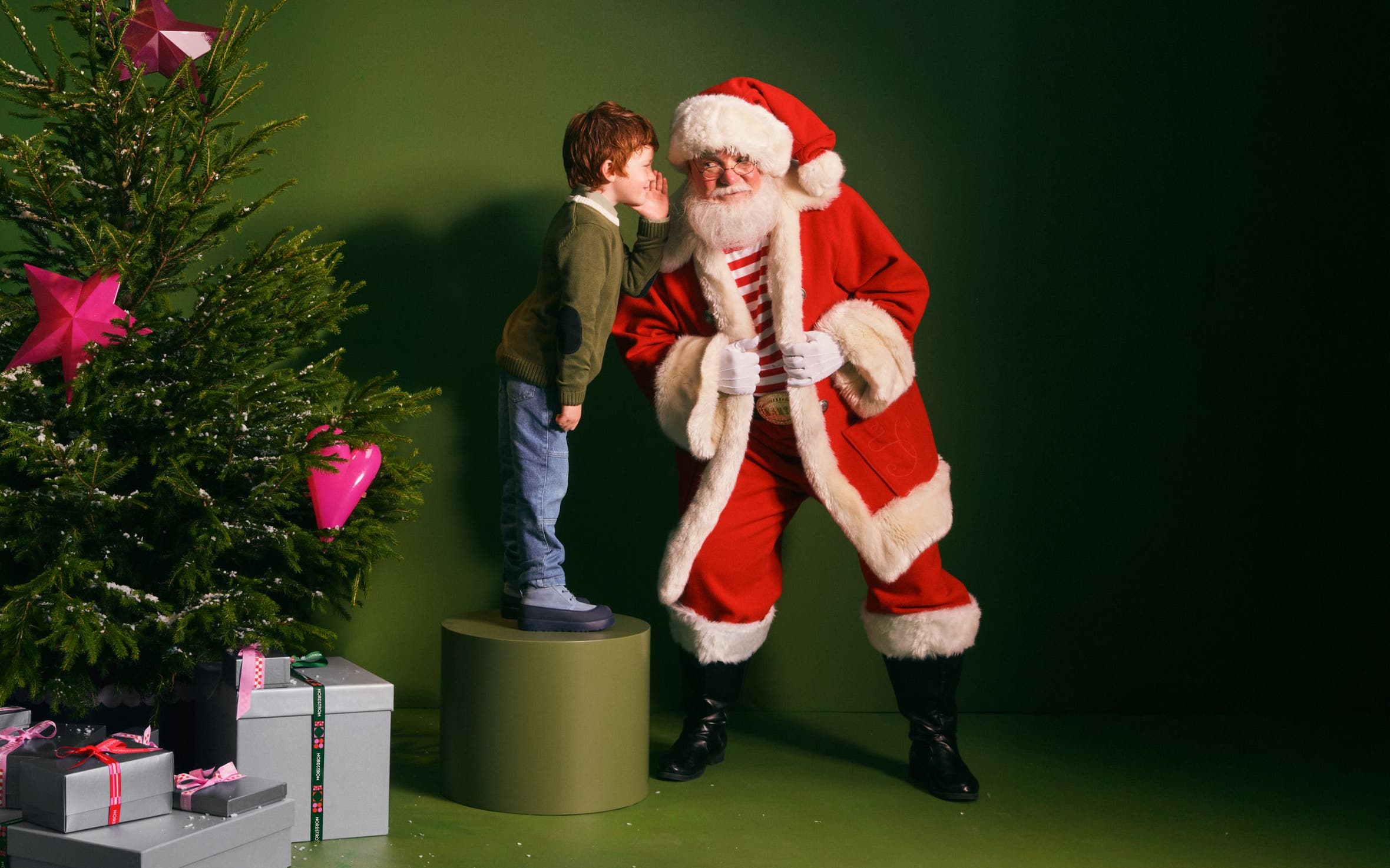 A boy talking to Santa.