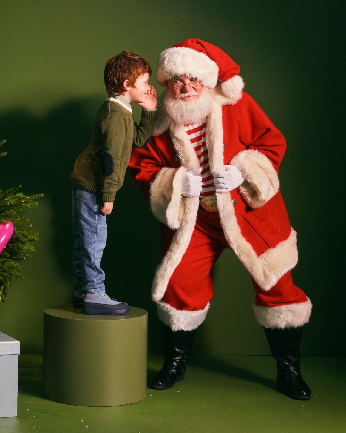 A boy talking to Santa.
