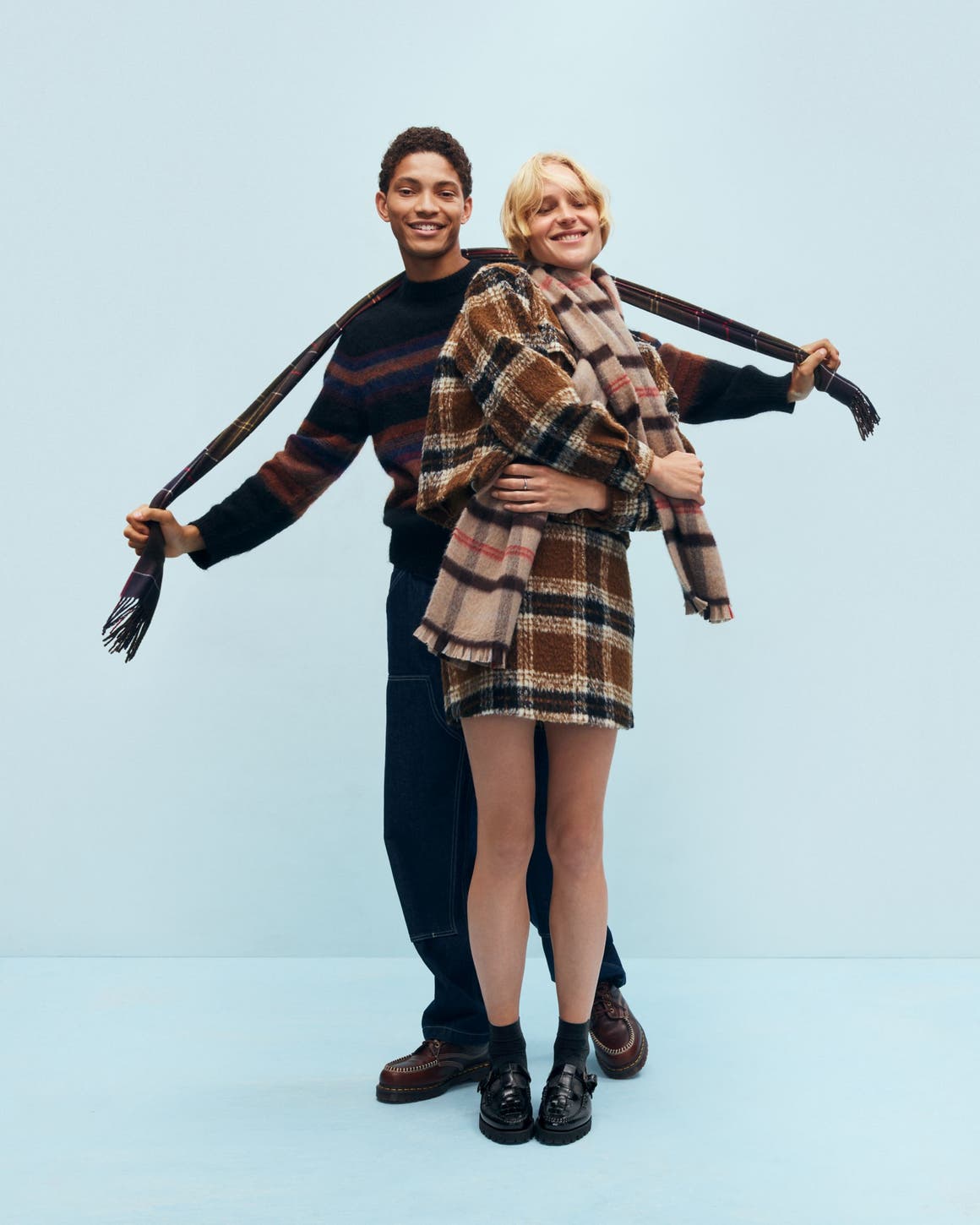 A man and woman bundled up for cold weather.