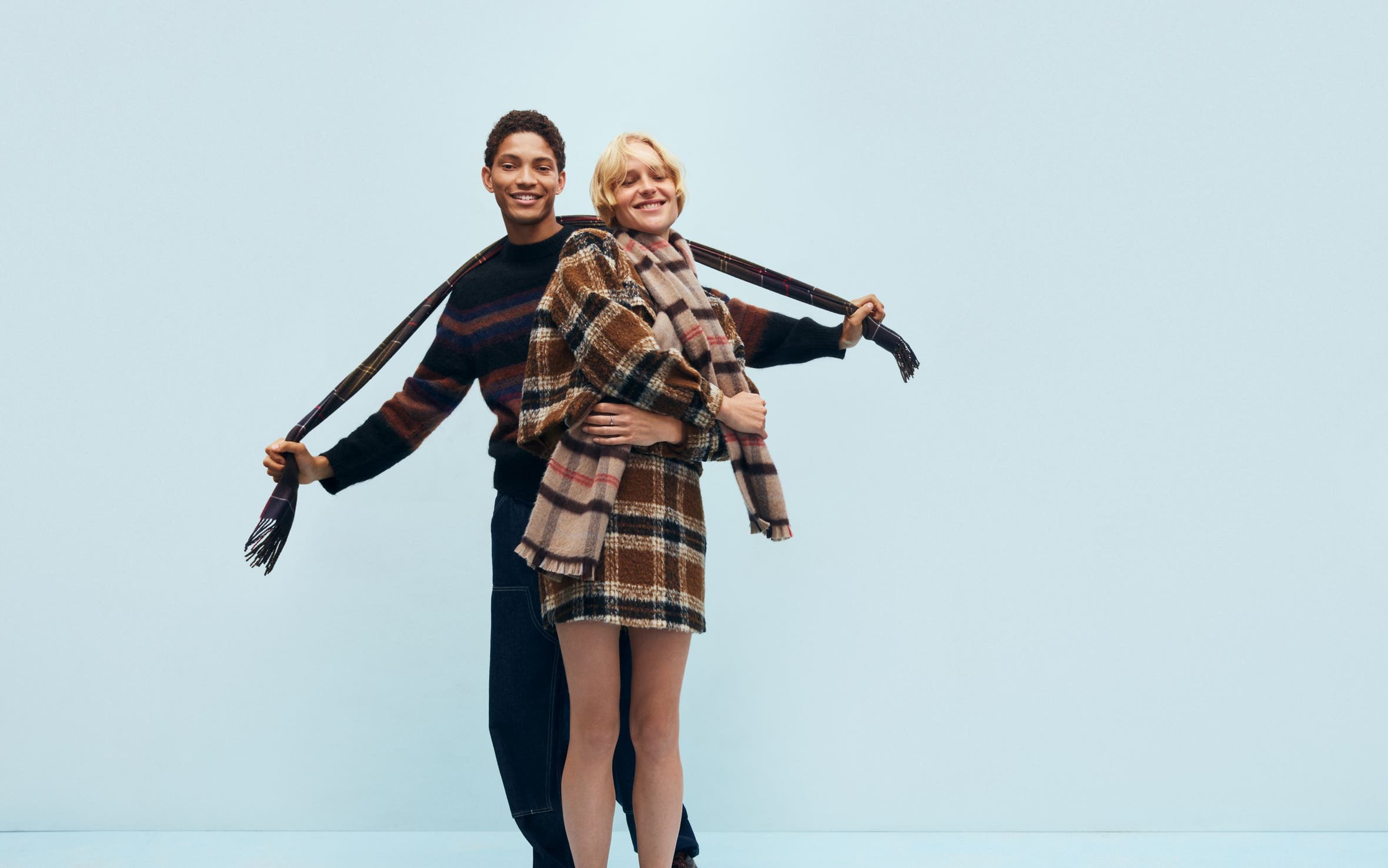 A man and woman bundled up for cold weather.