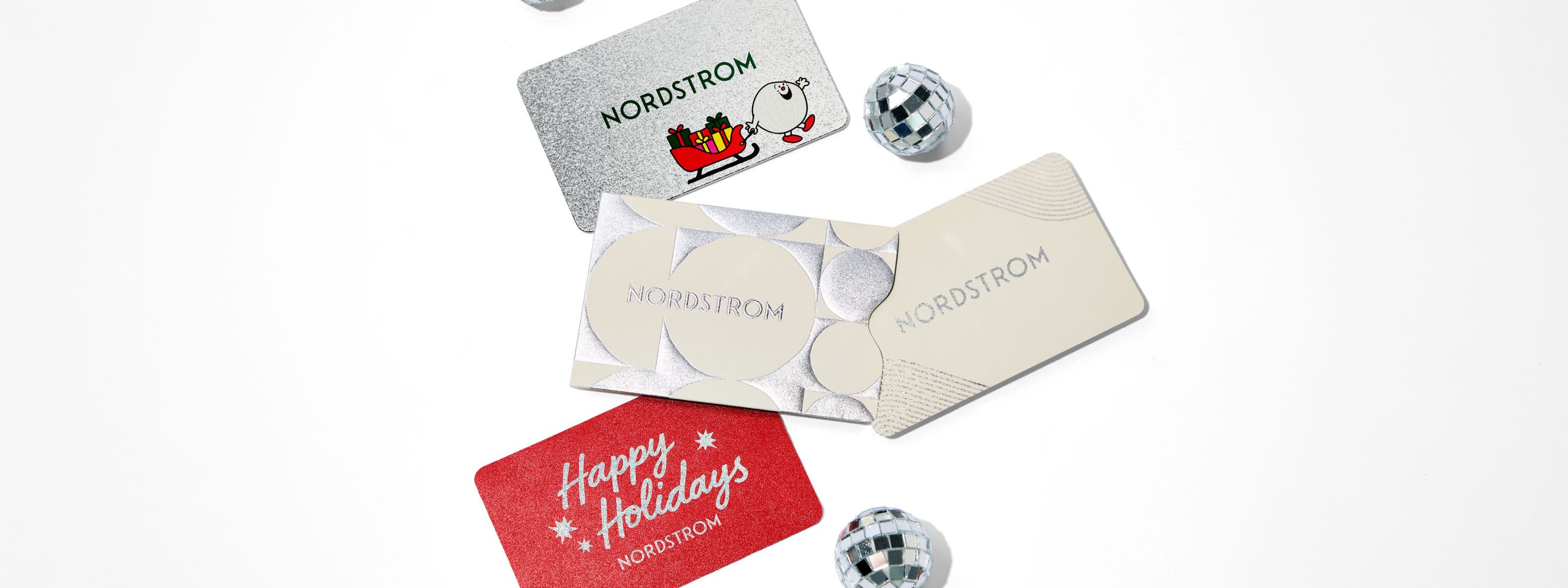 Assortment of Nordstrom Holiday gifts cards.
