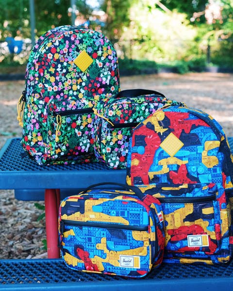 Brightly patterned backpacks and lunchboxes.