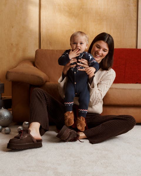 A woman holding a baby.