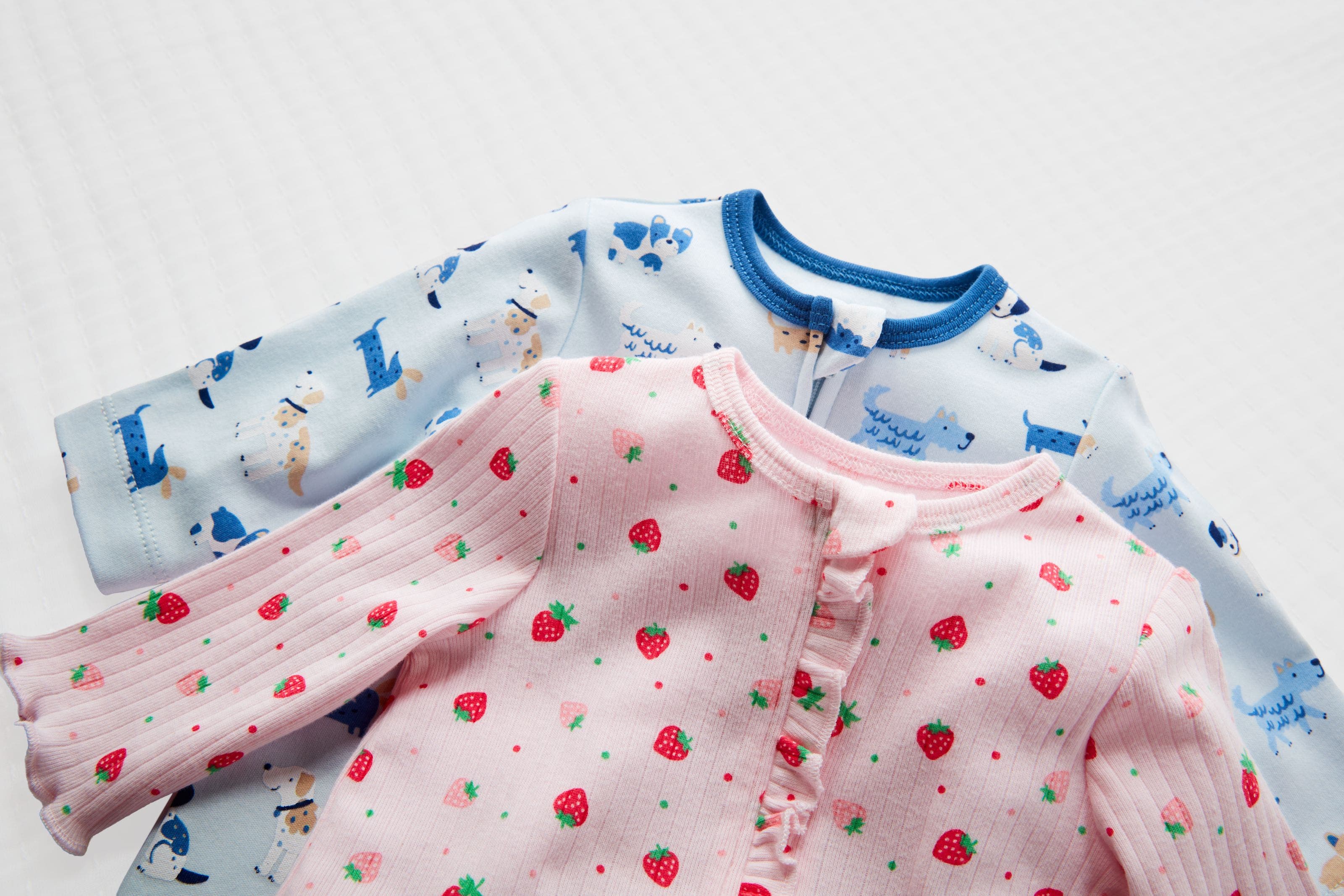 A pair of printed onesies.